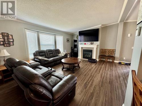 2830 Christopher Lea Estates, Dawson Creek, BC - Indoor Photo Showing Living Room With Fireplace