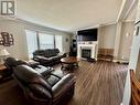 2830 Christopher Lea Estates, Dawson Creek, BC  - Indoor Photo Showing Living Room With Fireplace 