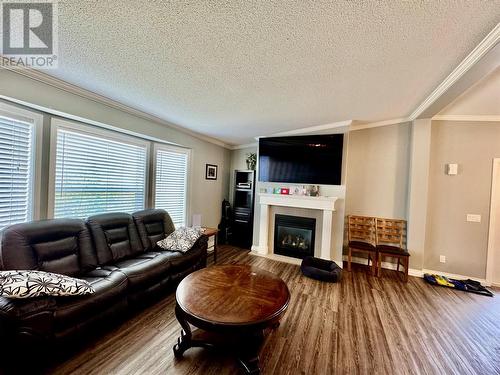 2830 Christopher Lea Estates, Dawson Creek, BC - Indoor Photo Showing Living Room With Fireplace