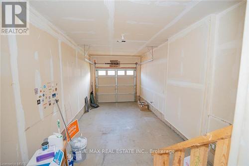 32 Longboat Run West, Brantford, ON - Indoor Photo Showing Garage