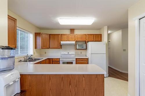 115 6841 138 St, Surrey, BC - Indoor Photo Showing Kitchen With Double Sink