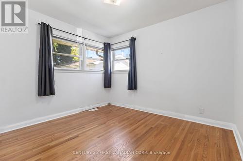 Vacant bedroom with blue shears/curtains - 225 Dawn Drive, London, ON - Indoor Photo Showing Other Room