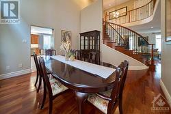 open-to-above dining room with large windows - 