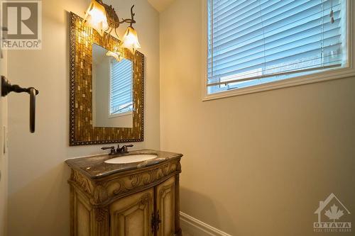 main floor powder room with window - 1030 Goward Drive, Kanata, ON - Indoor Photo Showing Bathroom