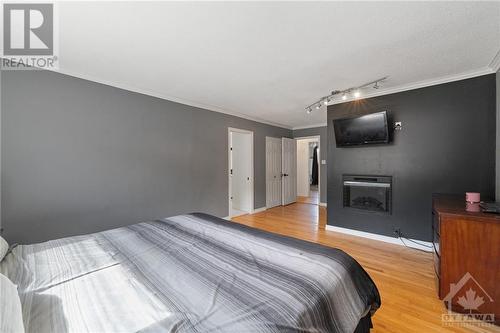 1310 Lacroix Road, Hammond, ON - Indoor Photo Showing Bedroom With Fireplace