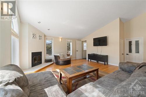 1310 Lacroix Road, Hammond, ON - Indoor Photo Showing Living Room With Fireplace