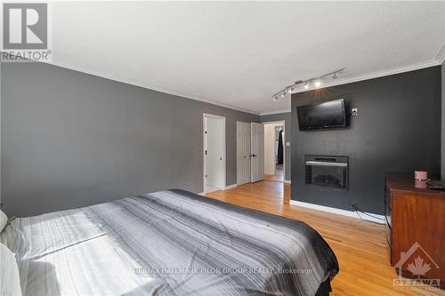 1310 Lacroix Road, Clarence-Rockland, ON - Indoor Photo Showing Bedroom With Fireplace