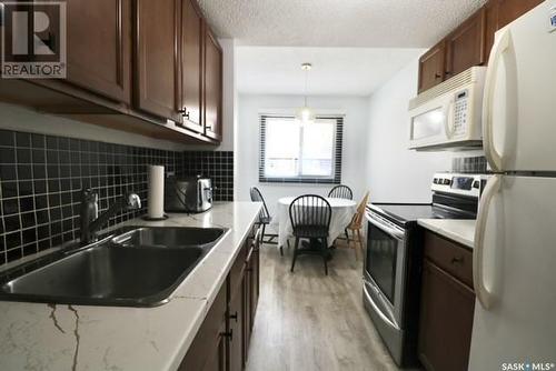 3844 Castle Road, Regina, SK - Indoor Photo Showing Kitchen With Double Sink