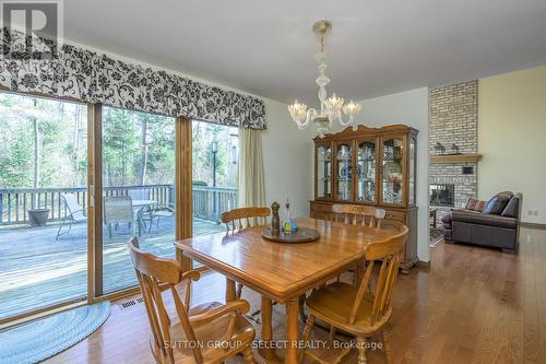 10364 Pinetree Drive, Lambton Shores (Grand Bend), ON - Indoor Photo Showing Dining Room With Fireplace