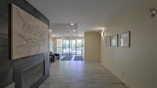 111-700 Martin Avenue, Kelowna, BC - Indoor Photo Showing Other Room With Fireplace