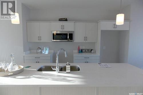 115 Taube Avenue, Saskatoon, SK - Indoor Photo Showing Kitchen With Double Sink