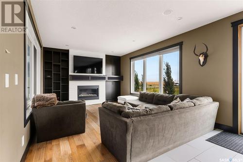 151 Centennial Drive, Grand Coulee, SK - Indoor Photo Showing Living Room With Fireplace