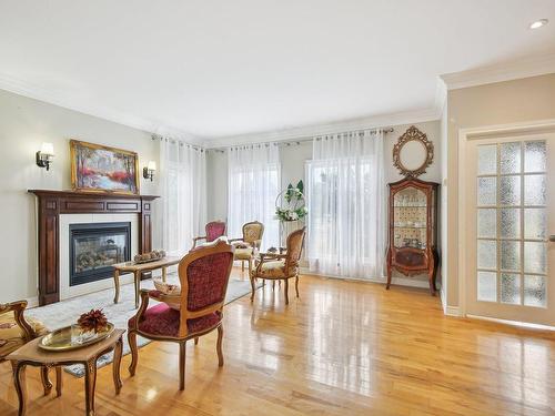 Living room - 2631 Rue Principale, Sainte-Julie, QC - Indoor With Fireplace