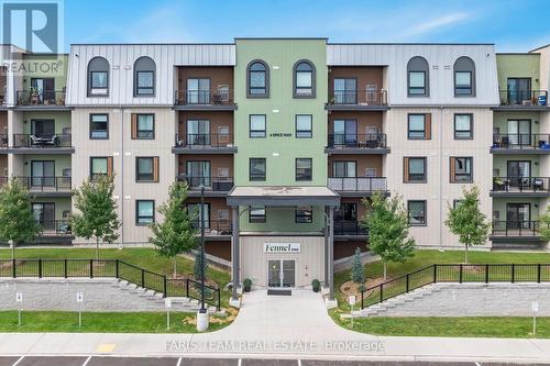 302 - 6 Spice Way, Barrie (Innis-Shore), ON - Outdoor With Balcony With Facade