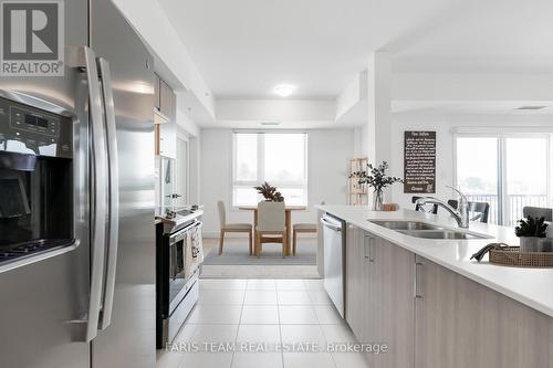 302 - 6 Spice Way, Barrie (Innis-Shore), ON - Indoor Photo Showing Kitchen With Double Sink With Upgraded Kitchen