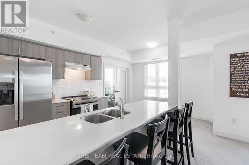 302 - 6 Spice Way, Barrie (Innis-Shore), ON - Indoor Photo Showing Kitchen With Double Sink With Upgraded Kitchen