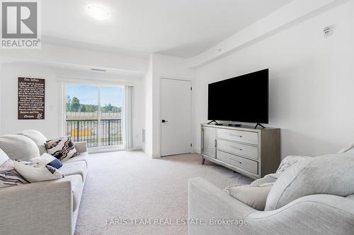 302 - 6 Spice Way, Barrie (Innis-Shore), ON - Indoor Photo Showing Living Room