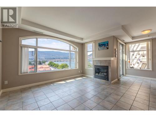 100 Lakeshore Drive W Unit# 714, Penticton, BC - Indoor Photo Showing Living Room With Fireplace