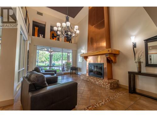 100 Lakeshore Drive W Unit# 714, Penticton, BC - Indoor Photo Showing Living Room With Fireplace