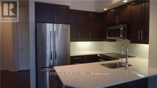 323 - 65 East Liberty Street, Toronto, ON - Indoor Photo Showing Kitchen With Stainless Steel Kitchen With Upgraded Kitchen