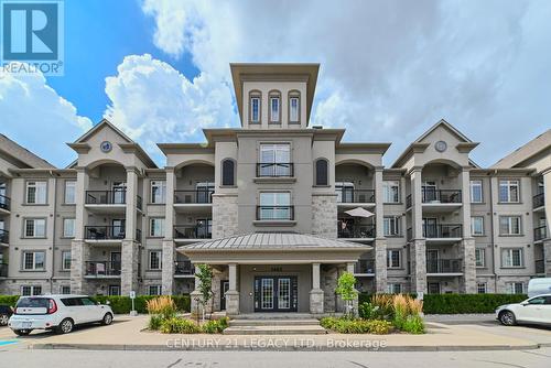 214 - 1460 Main Street E, Milton (Dempsey), ON - Outdoor With Balcony With Facade