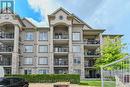 214 - 1460 Main Street E, Milton (Dempsey), ON  - Outdoor With Balcony With Facade 