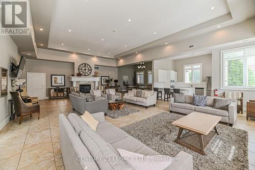 214 - 1460 Main Street E, Milton (Dempsey), ON - Indoor Photo Showing Living Room With Fireplace