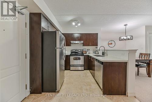 214 - 1460 Main Street E, Milton (Dempsey), ON - Indoor Photo Showing Kitchen