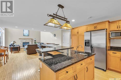 422 Beechmont Place, Saskatoon, SK - Indoor Photo Showing Kitchen With Fireplace