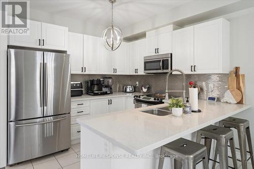 611 Murray Meadows Place, Milton (Clarke), ON - Indoor Photo Showing Kitchen With Stainless Steel Kitchen With Double Sink With Upgraded Kitchen