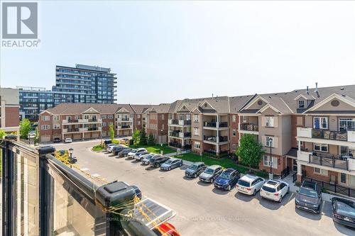 302 - 216 Oak Park Boulevard, Oakville (Uptown Core), ON - Outdoor With Balcony With Facade