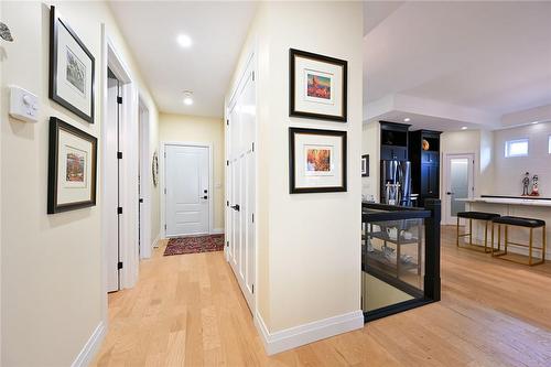 Hall Leading to Oversized 2.5 Car Garage with Epoxy Flooring and Rear Yard Access - 50 Bluenose Drive, Port Dover, ON - Indoor Photo Showing Other Room