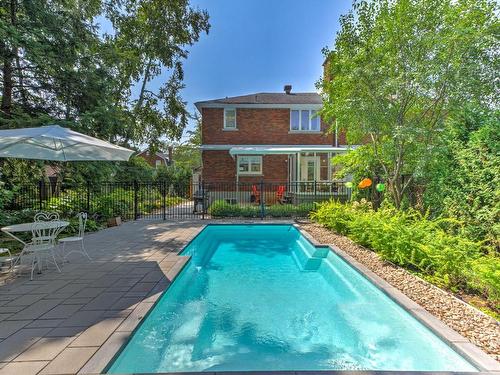 Back facade - 470 Av. De Dulwich, Saint-Lambert, QC - Outdoor With In Ground Pool With Backyard