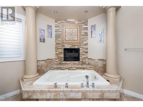 375 Trumpeter Court, Kelowna, BC - Indoor Photo Showing Bathroom With Fireplace