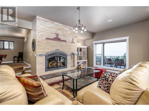 375 Trumpeter Court, Kelowna, BC - Indoor Photo Showing Living Room With Fireplace