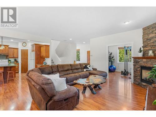 1041 Paret Crescent, Kelowna, BC - Indoor Photo Showing Living Room With Fireplace