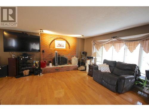 1516 114 Avenue, Dawson Creek, BC - Indoor Photo Showing Living Room With Fireplace