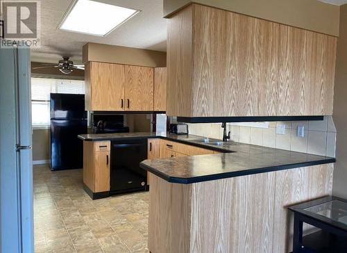 7437 Valley Heights Drive, Grand Forks, BC - Indoor Photo Showing Kitchen With Double Sink