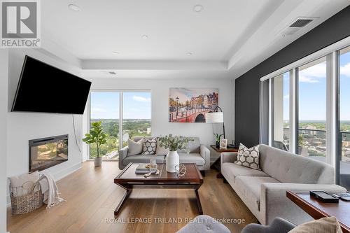 2303 - 505 Talbot Street, London, ON - Indoor Photo Showing Living Room With Fireplace