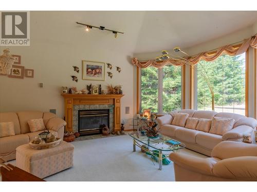 2718 Osachoff Road, South Slocan, BC - Indoor Photo Showing Living Room With Fireplace