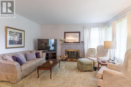 830 Kildare Road, Peterborough (Monaghan), ON - Indoor Photo Showing Living Room With Fireplace