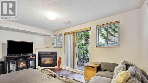 6 - 36 Mendota Road, Toronto (Stonegate-Queensway), ON - Indoor Photo Showing Living Room With Fireplace