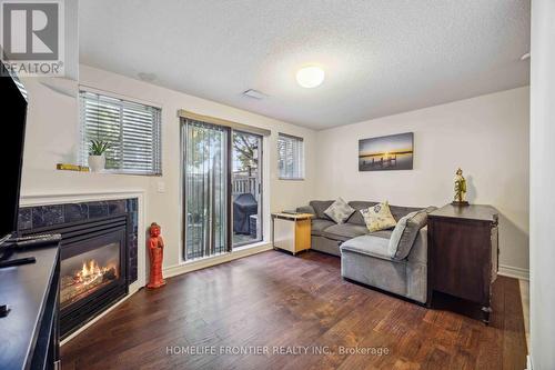 6 - 36 Mendota Road, Toronto (Stonegate-Queensway), ON - Indoor Photo Showing Living Room With Fireplace