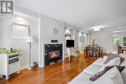 6 - 36 Mendota Road, Toronto (Stonegate-Queensway), ON - Indoor Photo Showing Living Room With Fireplace