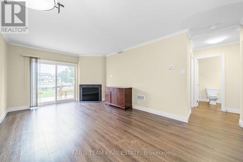 14 - 60 Laguna Parkway, Ramara (Brechin), ON - Indoor Photo Showing Living Room With Fireplace