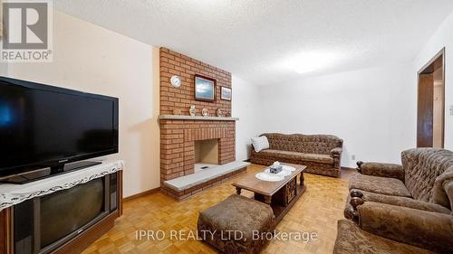 77 Flowertown Avenue, Brampton (Northwood Park), ON - Indoor Photo Showing Living Room With Fireplace