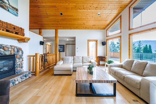 10 Candide Drive, Lumby, BC - Indoor Photo Showing Living Room With Fireplace