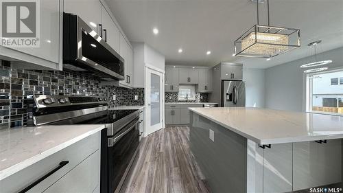 755 Delainey Court, Saskatoon, SK - Indoor Photo Showing Kitchen With Upgraded Kitchen