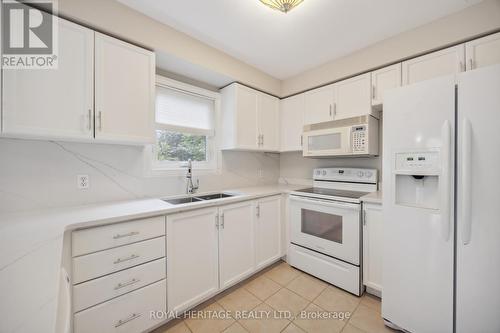 50 Valleywood Drive, Whitby (Williamsburg), ON - Indoor Photo Showing Kitchen With Double Sink