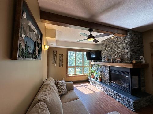 2203 - 7495 Columbia Avenue, Radium Hot Springs, BC - Indoor Photo Showing Living Room With Fireplace